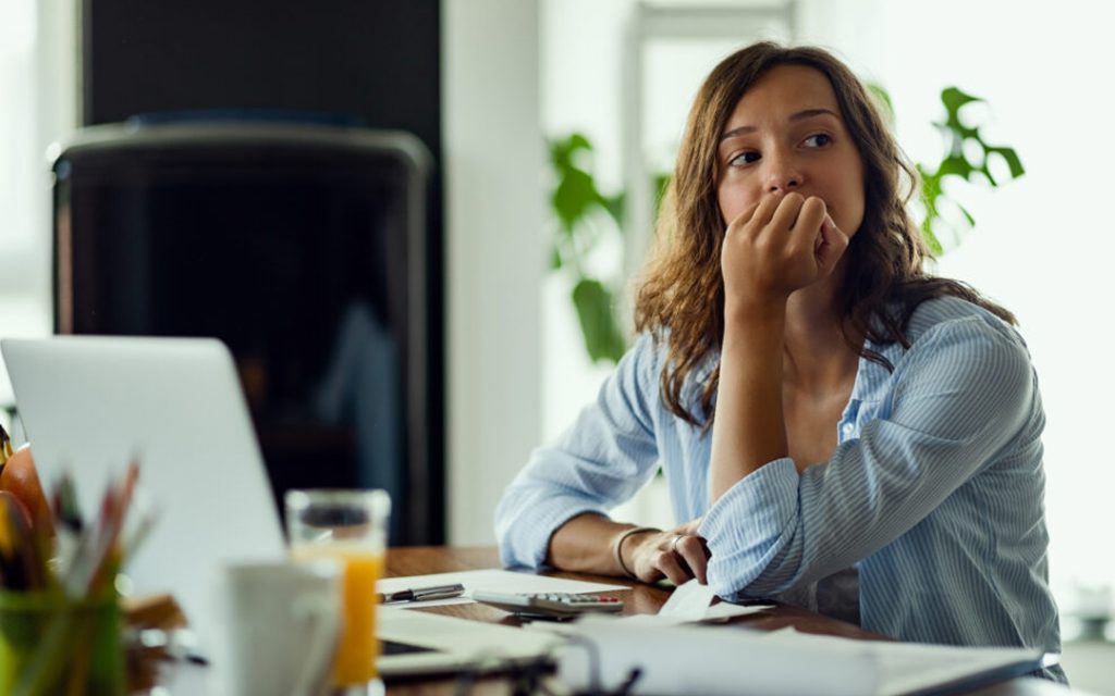 Person with depression learning how to tell if they are depressed by recognizing the signs of depression through self-assessment